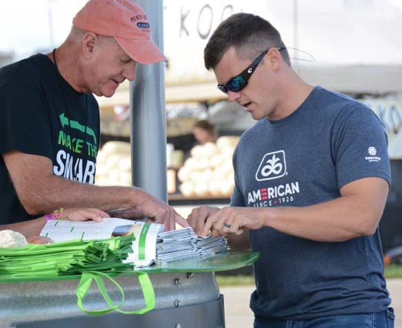 Two attendees talking at Farm Progress
